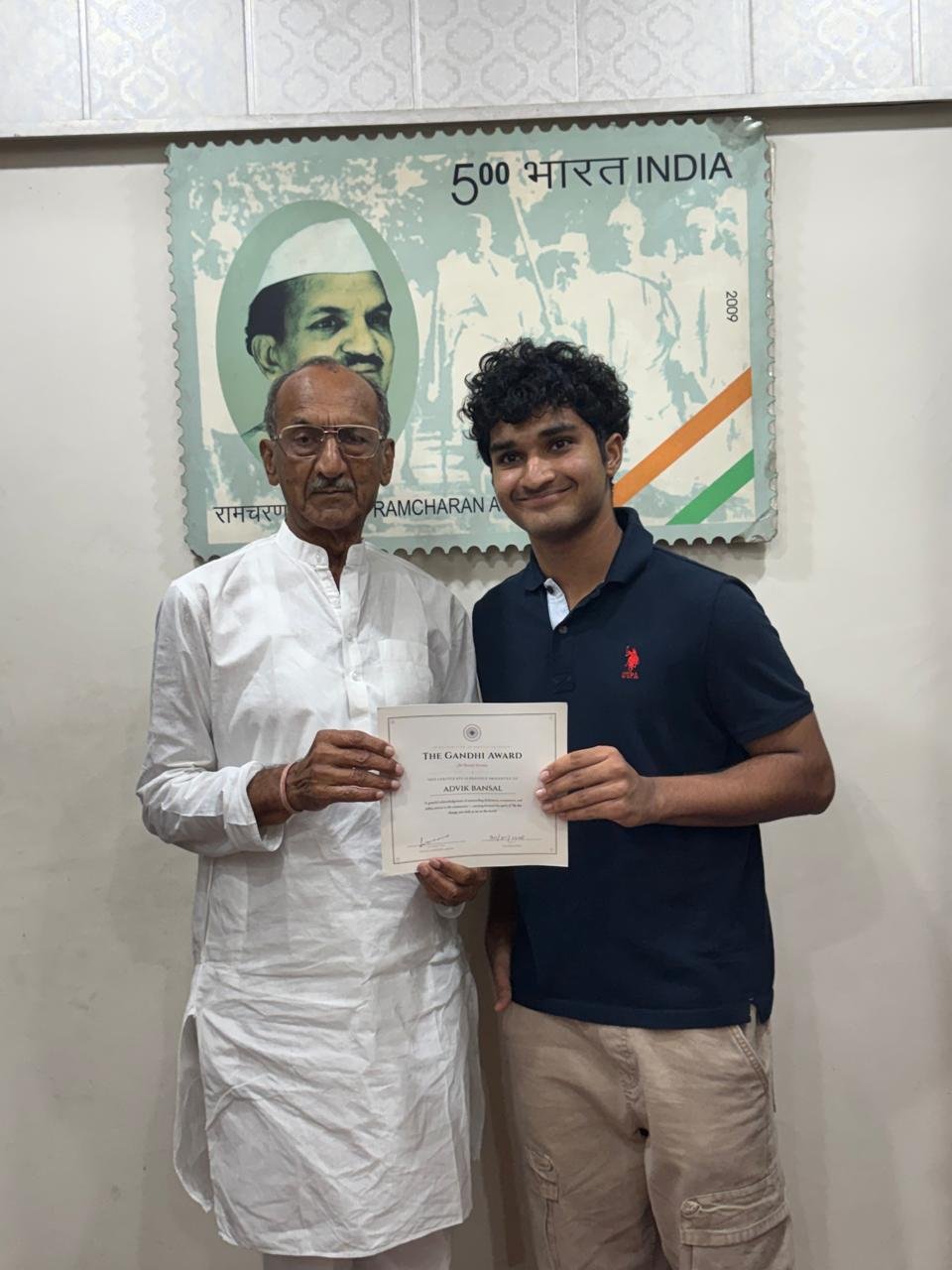 Holding the Gandhi Award certificate together after it was presented