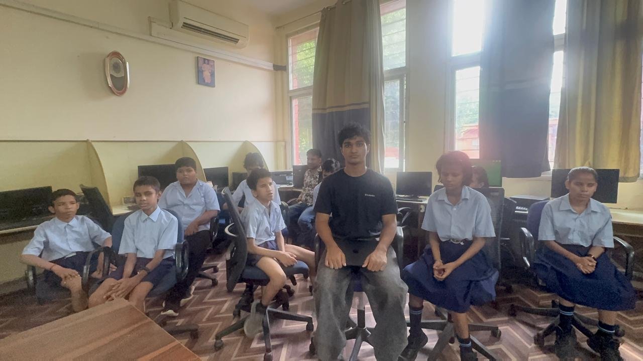 Group photo with students seated together after a workshop session
