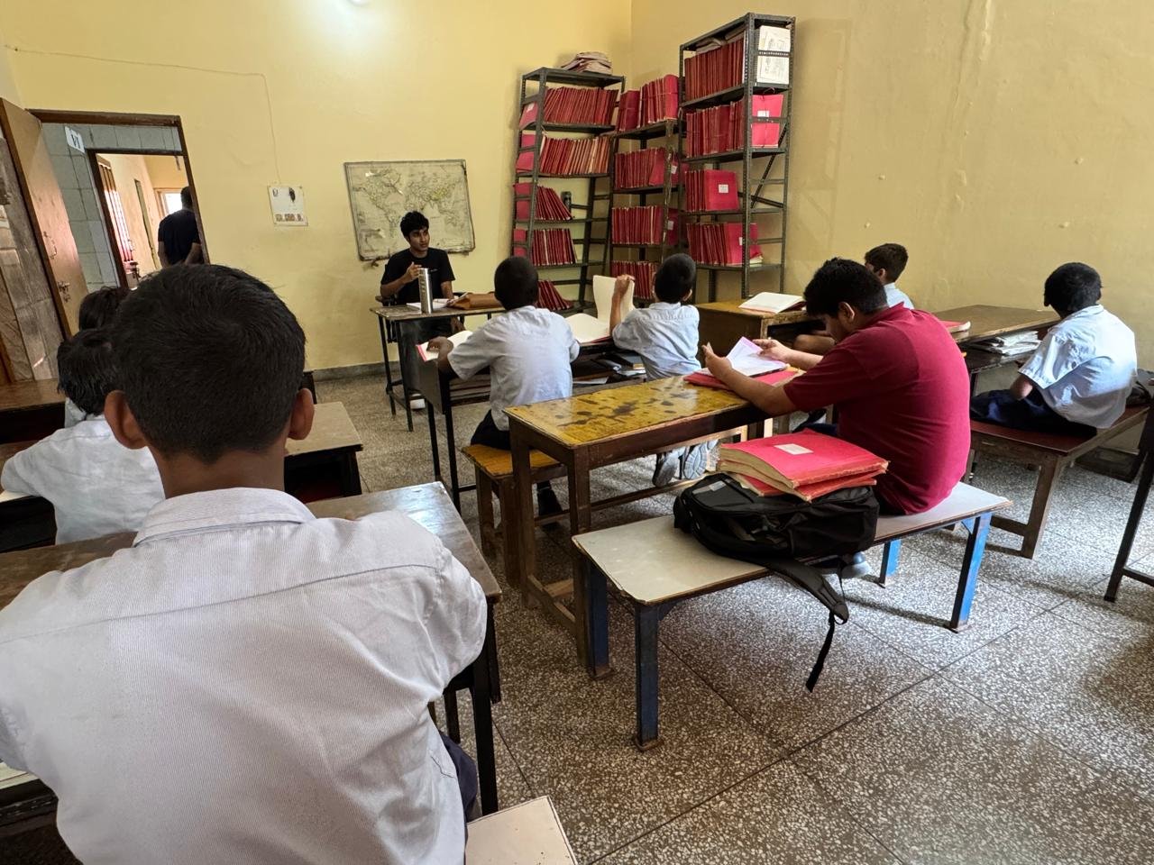 Teaching the class while a student reads along in a braille textbook
