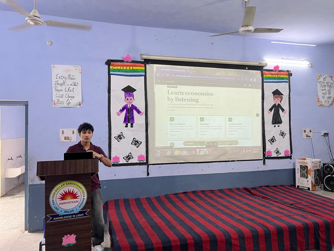 Pointing to the petition text projected on screen while explaining its provisions to students